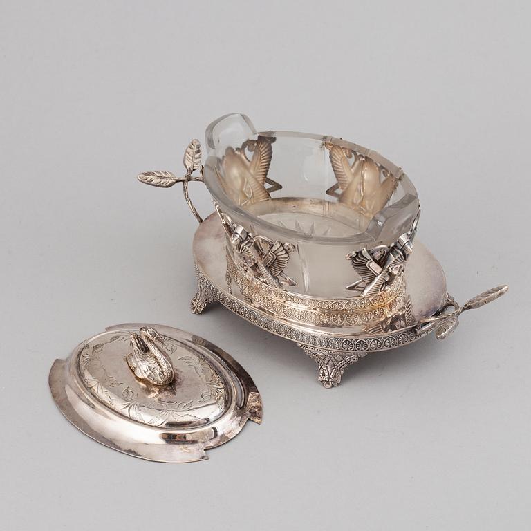 An 'Egyptian Empire style' silver plated caviar bowl with a blasted glass canister, ca 1900.