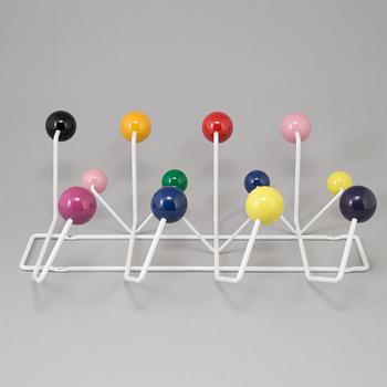 a "Hang it all" clothes hanger by Charles & Ray Eames for Vitra.