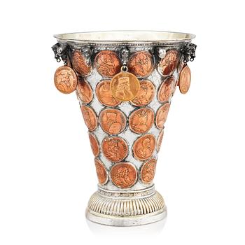 142. A Swedish 18th century parcel-gilt silver coin-beaker.