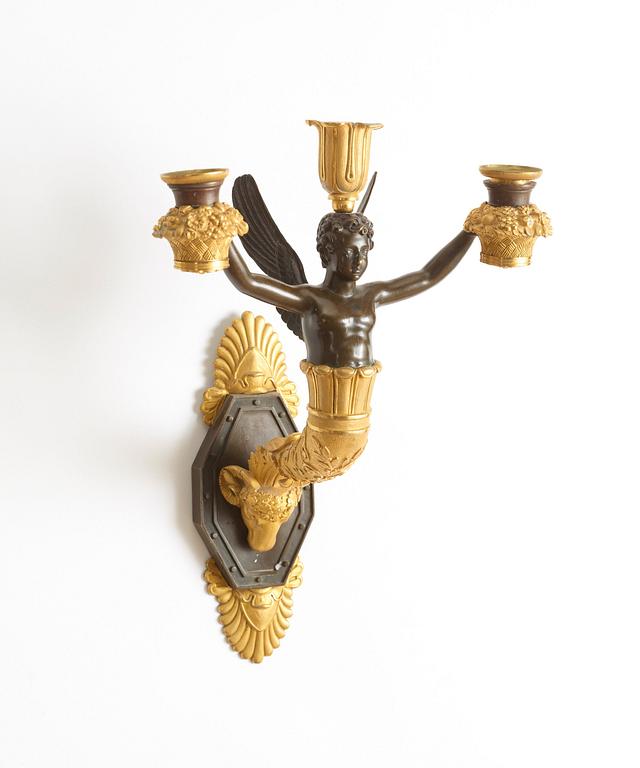 A French Empire early 19th century three-light wall-light.