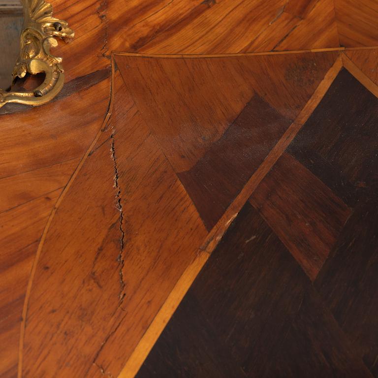 A Swedish rosewood-veneered Rococo chest of drawers, later part of the 18th century.