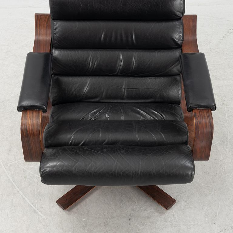 Karl-Erik Ekselius, a rosewood swivel armchair from JOC Vetlanda, 1980's.