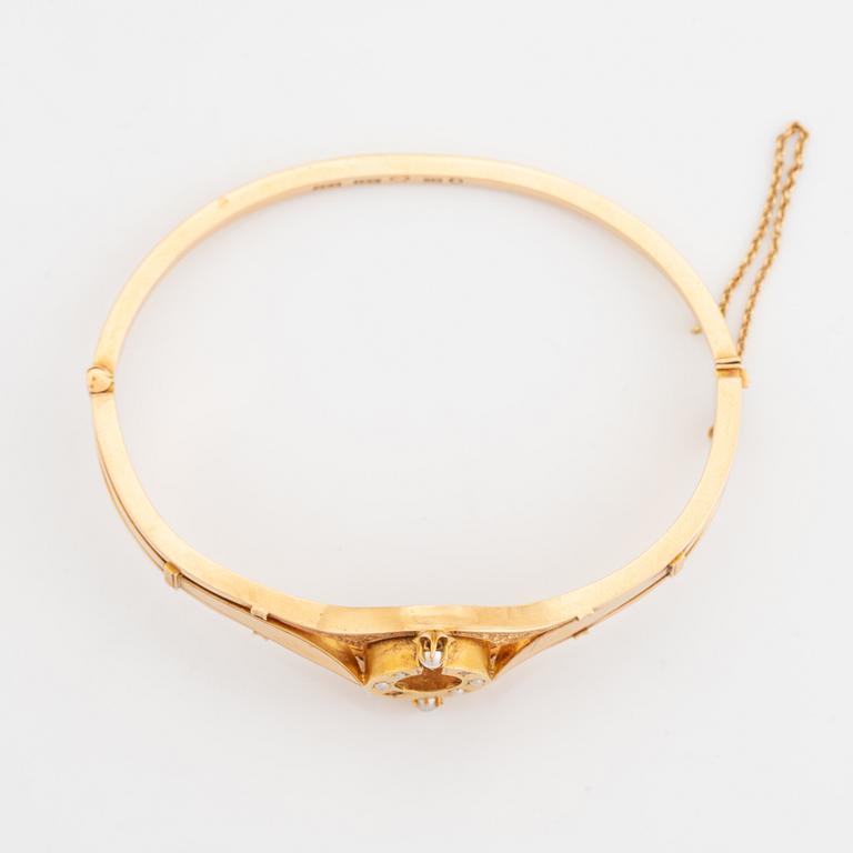 18K gold and seed pearl bangle.