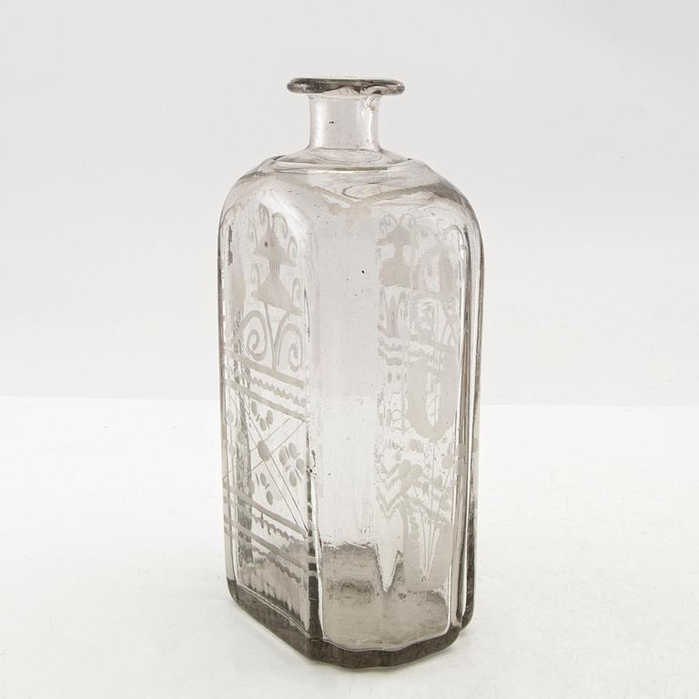 Flaska, glas. Troligen Skånska glasbruket, 1700-tal.