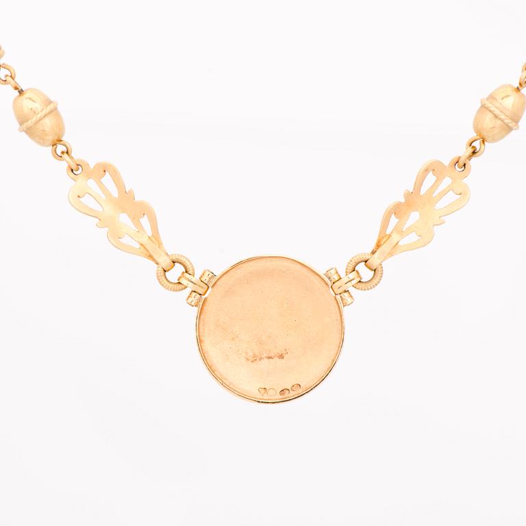 KAULAKORU, "Aurinkoleijona", 18K kultaa. Kalevala Koru 1998.