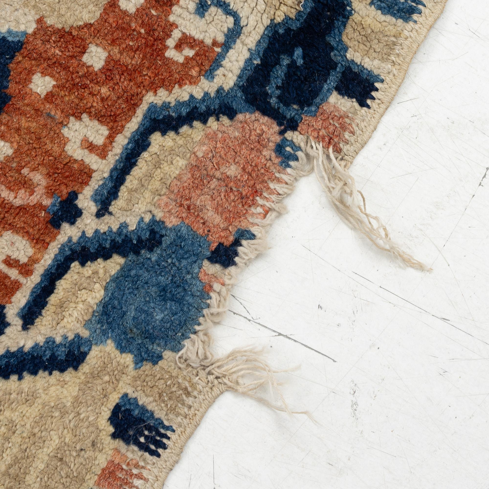 Two Chinese carpet fragments, late Qing dynasty.