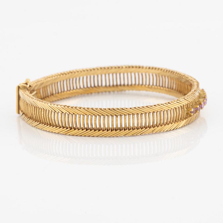 Armband 18K guld med rosa stenar.