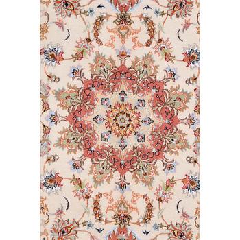 A Kashmar carpet, 295 x 200 cm.
