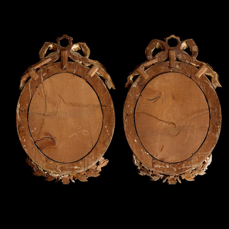 A pair of late Gustavian early 19th century one-light girandol mirrors.