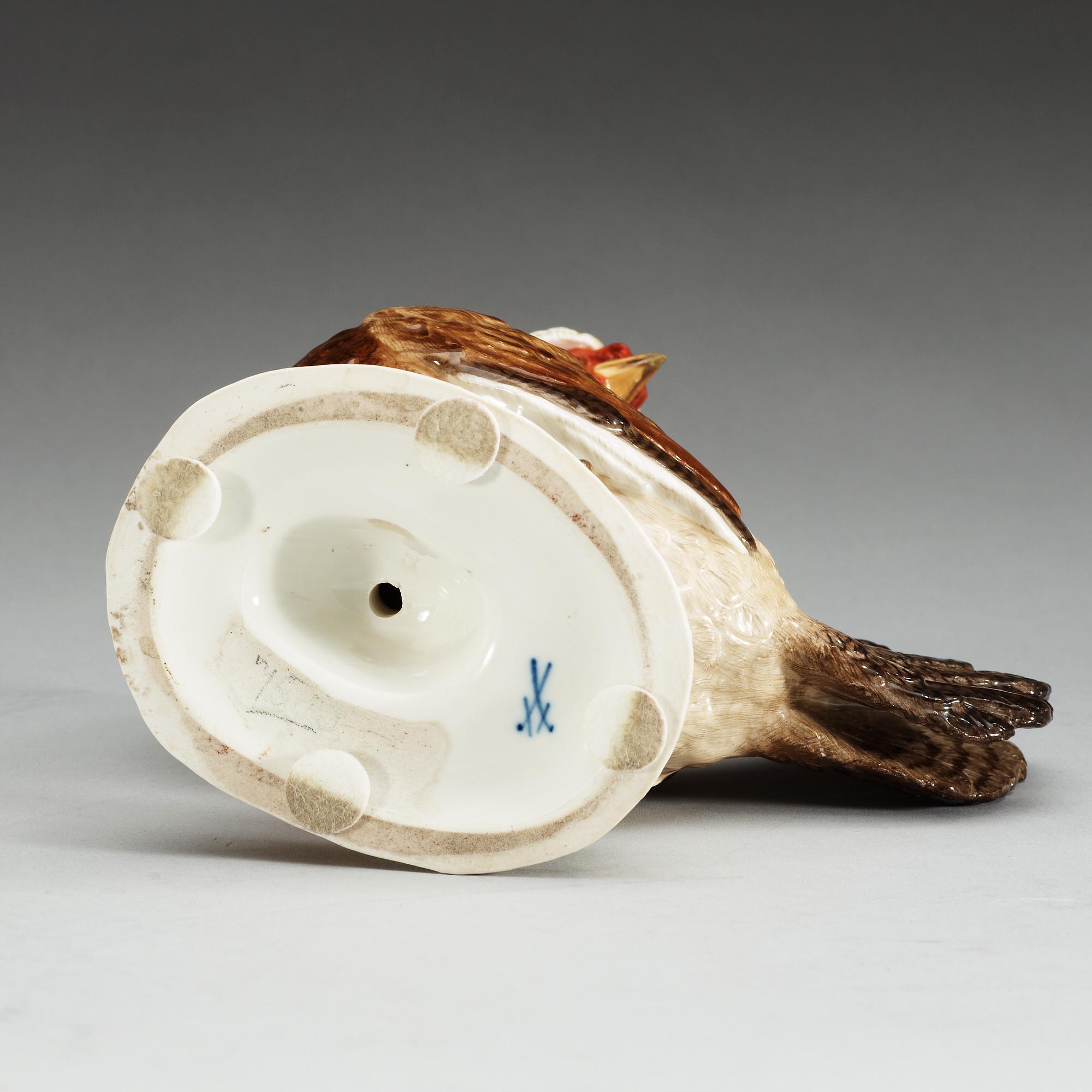 A Meissen figure of a hen with an egg, 19th Century.