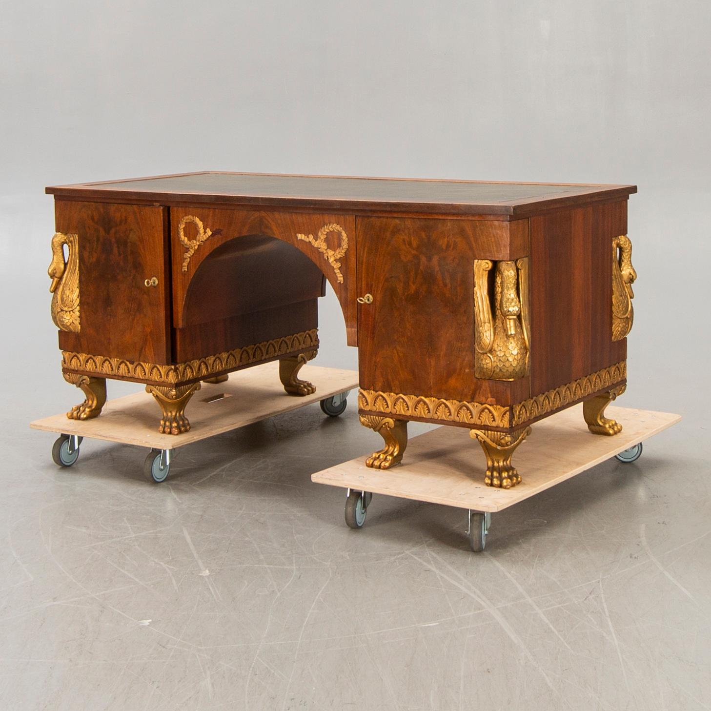 An Empire style mahogany desk 20th century.
