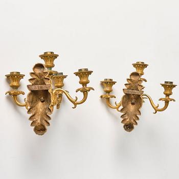 A pair of late Empire ormolu four-branch wall lights, circa 1840.