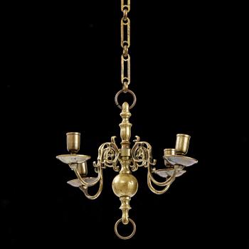 A four-branch baroque brass chandelier, late 17th century/circa 1700.