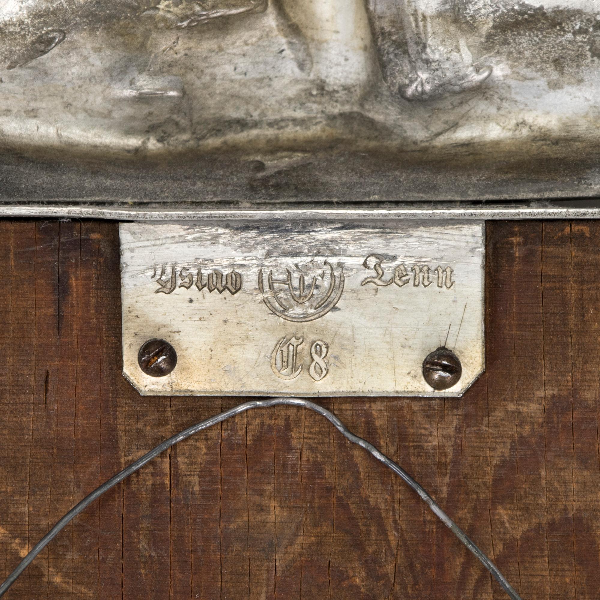 A Swedish Grace pewter wall mirror, Ystad Tenn (Ystad Metallindustri), Sweden 1929.
