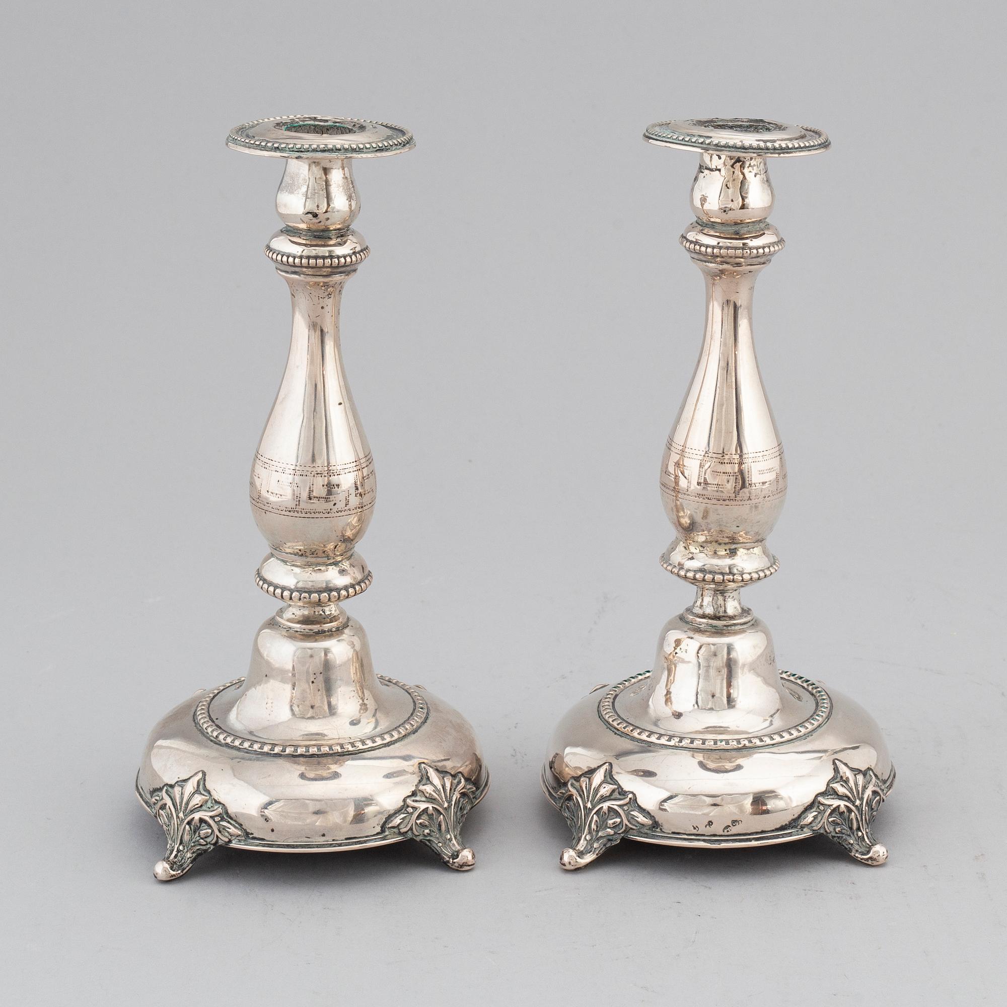 A pair of silver candlesticks, circa 1900.