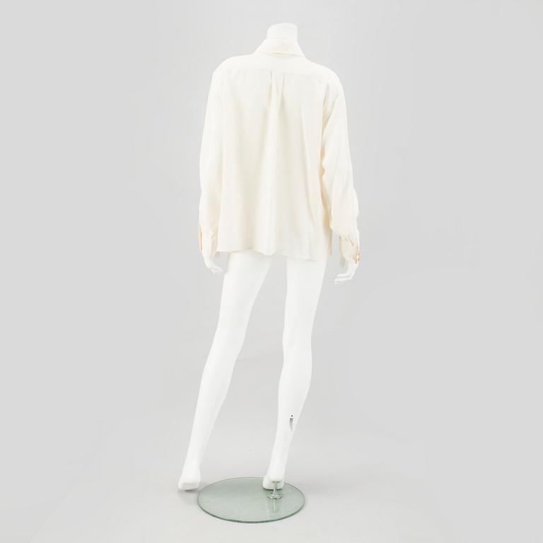 A Crepe de Chine Cream Coloured Silk Blouse by Chanel.