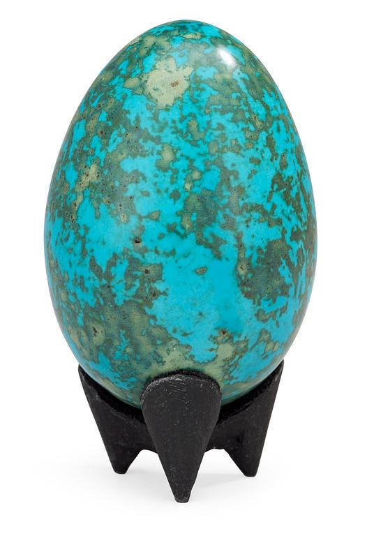 A Hans Hedberg faience egg on an iron base, Biot, France.