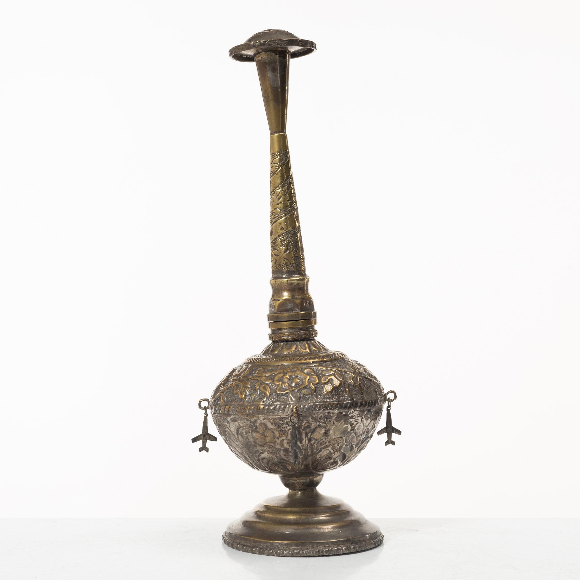 An 20th century british Raj repoussé metal rosewater sprinkler.