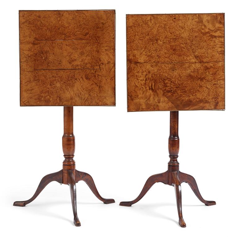 A pair of alder-veneered tilt-top tables by C. Hollst (master 1787-1830).