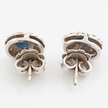Earrings, a pair of 18K white gold set with dark sapphires and small brilliant-cut diamonds.
