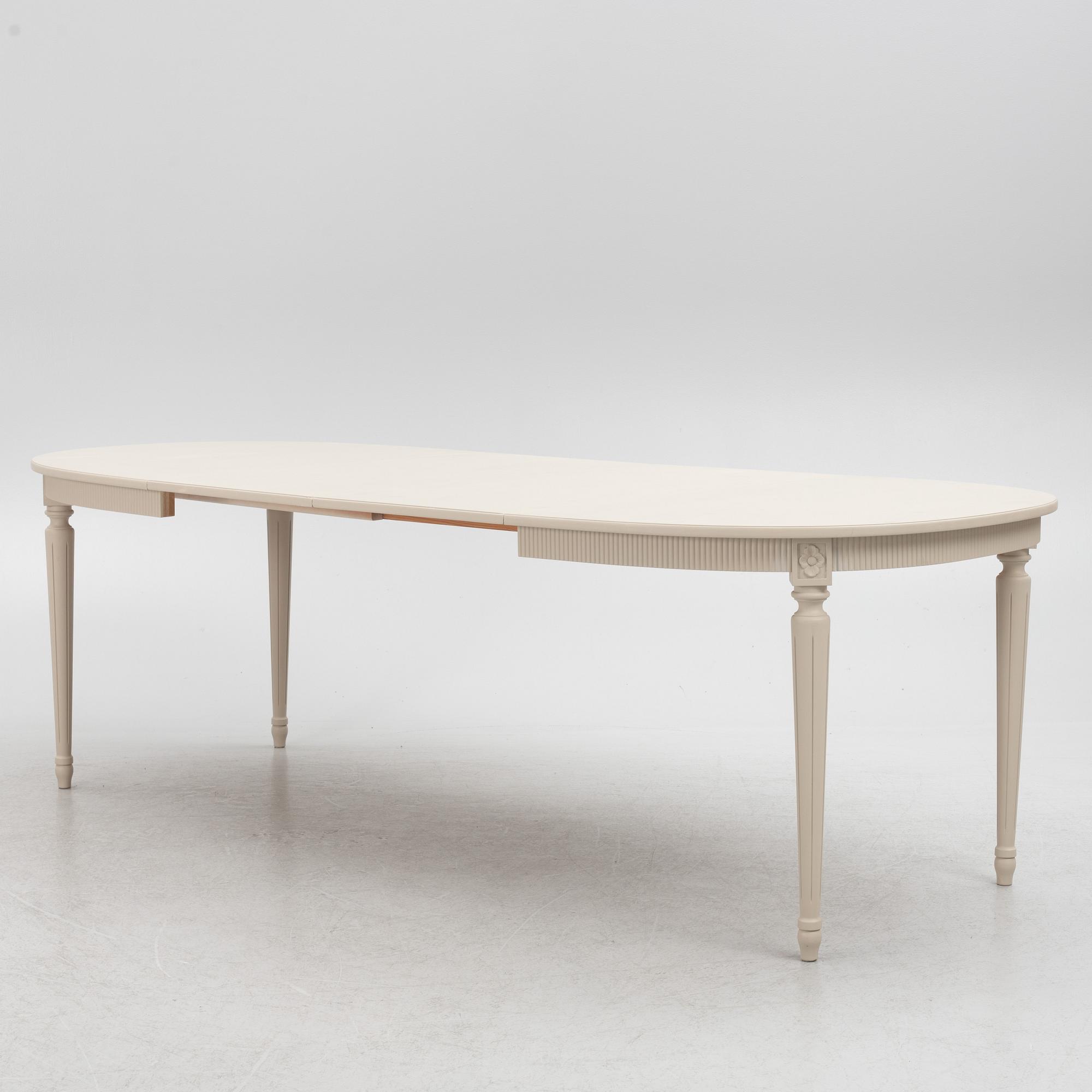 A Gustavian Style Dining Table and 10 Chairs, second half of the 20th Century.