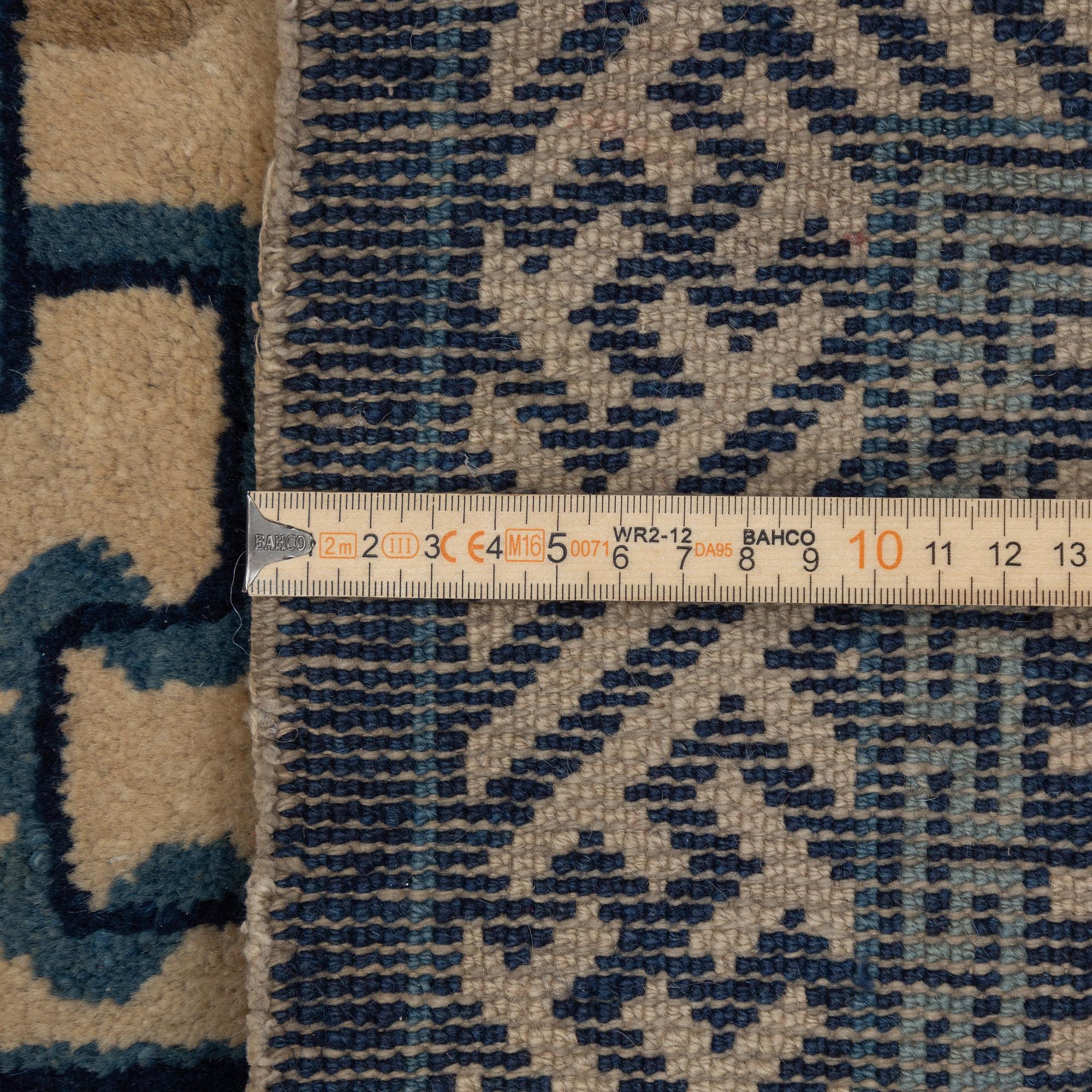 Two antique Chinese Pao-Tow rugs, c. 125 x 65 and 125 x 60 cm.