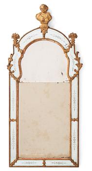 85. A Baroque gilt-lead and engraved glass mirror by Burchardt Precht (active in Stockholm 1674-1738).