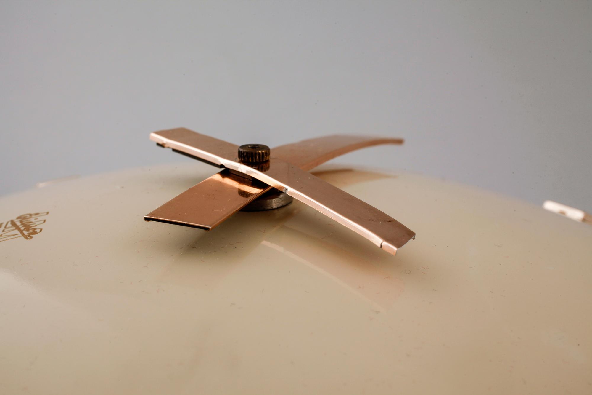 A 20th century wall clock by LM Ericsson.