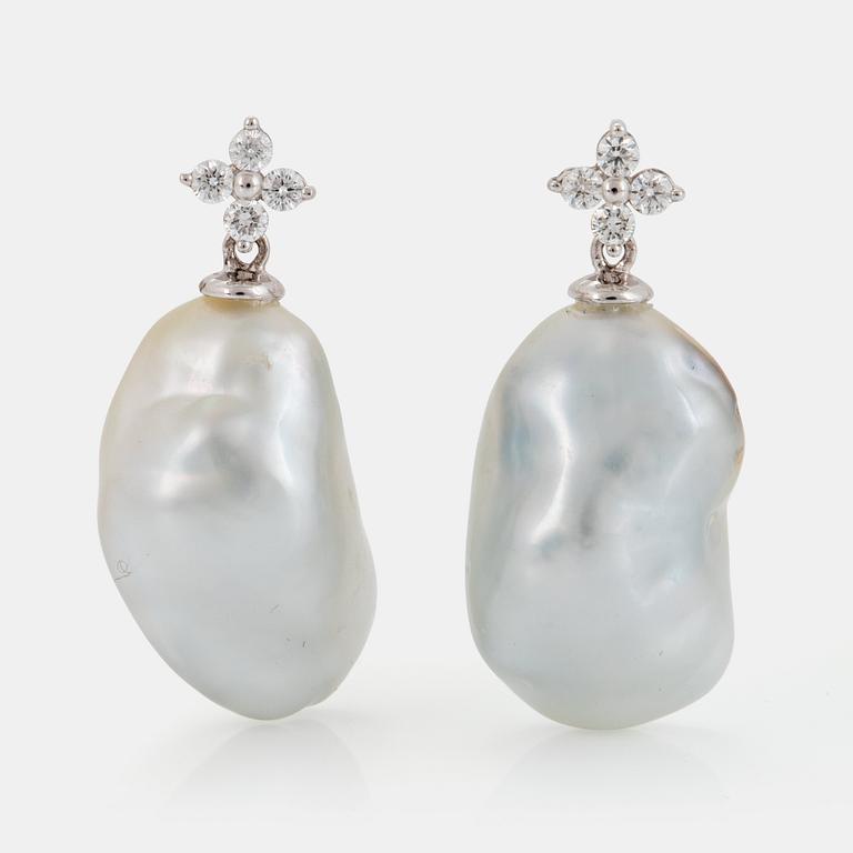 A pair of cultured South Sea pearl earrings in 18K white gold set with round brilliant-cut diamonds.