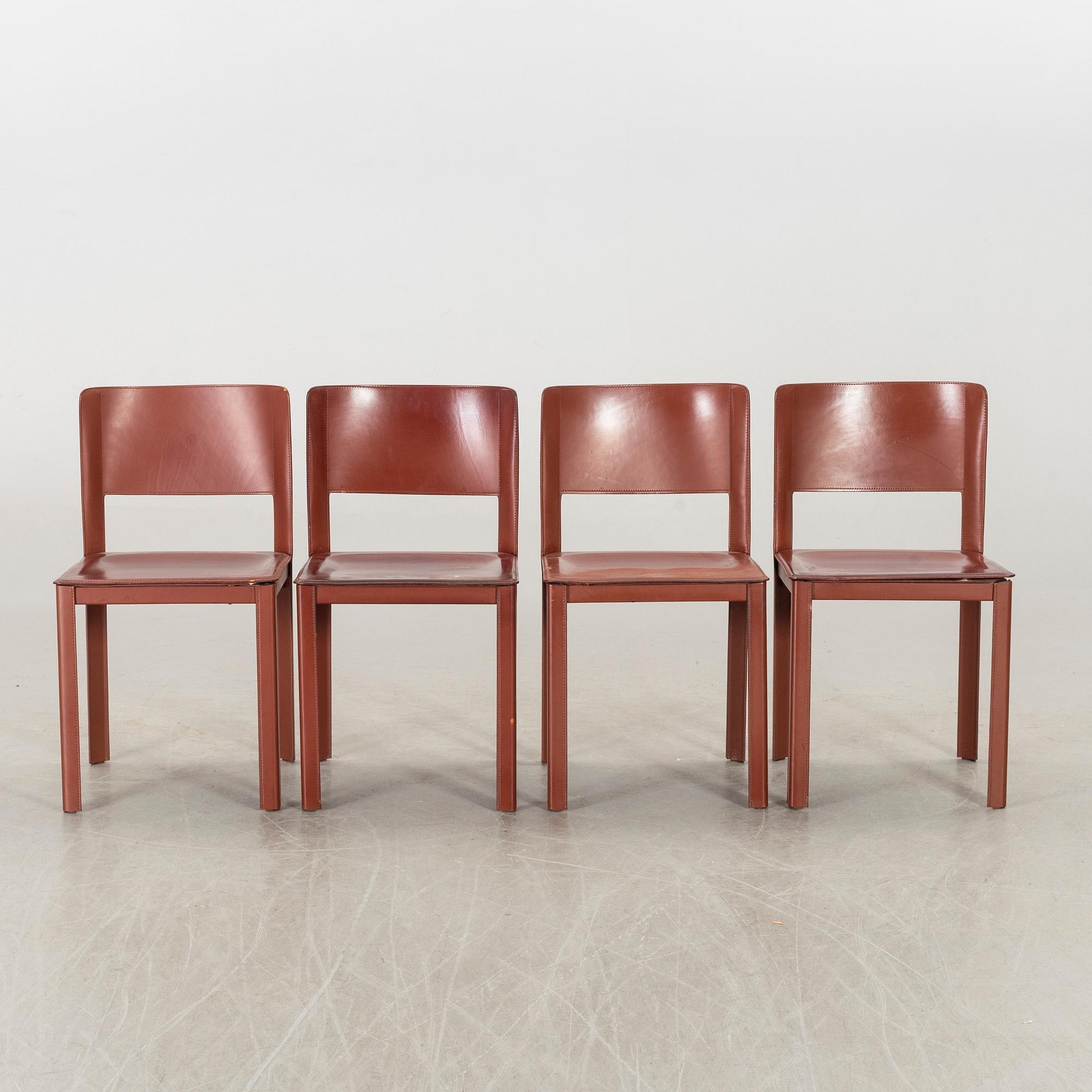 MATTEO GRASSI, a set of four leather chairs.