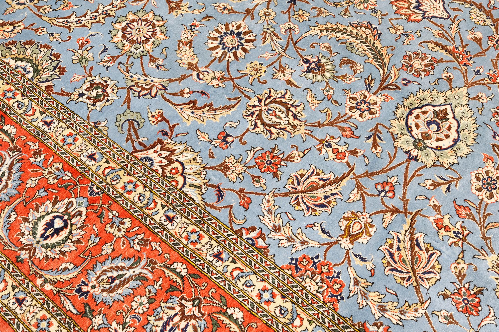 A Ghom carpet, part silk, approx. 480 x 350 cm.