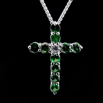 A CROSS PENDANT, 12 tsavorites 0.75 ct, 1 brilliant cut diamond 0,12 ct. VS.