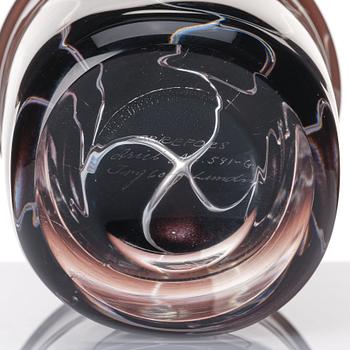 Ingeborg Lundin, an 'ariel' burgundy coloured glass vase decorated with faces, Orrefors Sweden 1972.