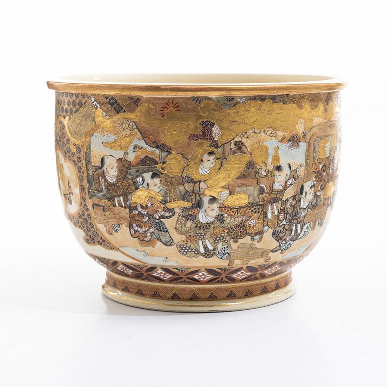 A Japanese satsuma figural flower pot, early 20th century.