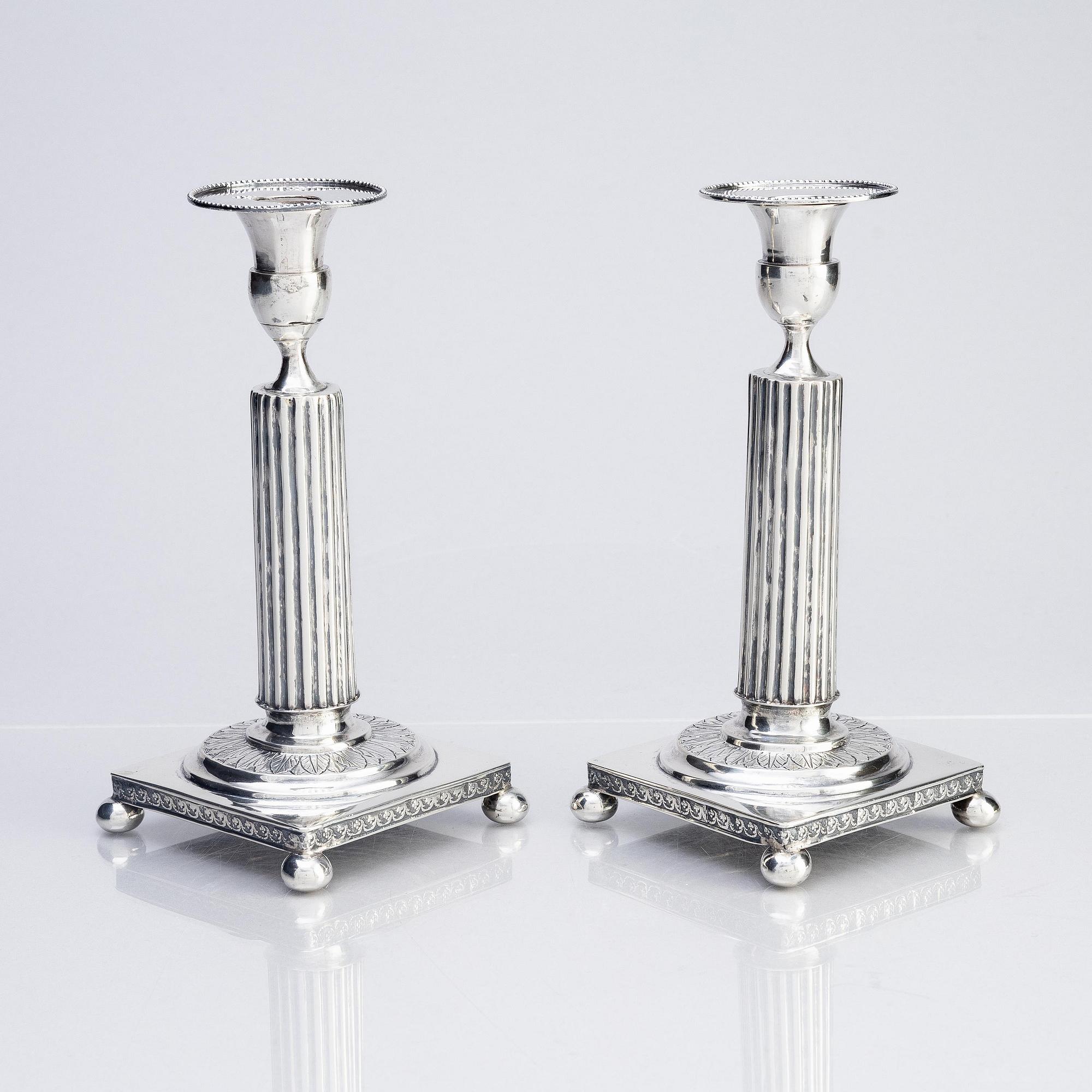A pair of Gustavian silver candlesticks, unclear maker's mark, the cuffs with mark of Pehr Zethelius, Stockholm 1796.