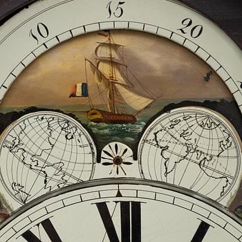 A long-case clock, England, 19th century.