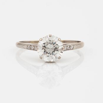 A round brilliant-cut diamond ring.