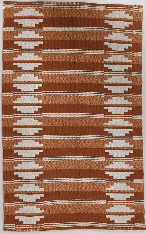 A flat weave carpet from around the middle of the 20th century.