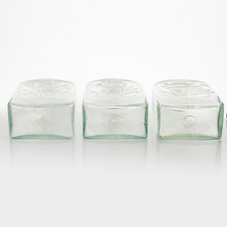 Three glass bottles in a box, Cederbergs Glasbruk, Sweden, first half of the 19th century.