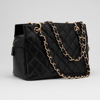 CHANEL, a black leather "Medium Shopping" handbag.