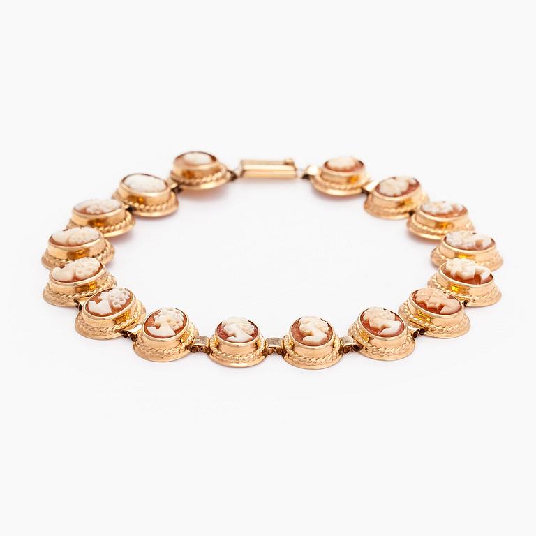 A 14K gold and shell cameo jewelry set, bracelet, pendant/brooch and ring.