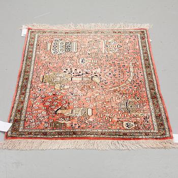 A RUG, AN OLD SILK QUM, ca 75 x 65 cm.