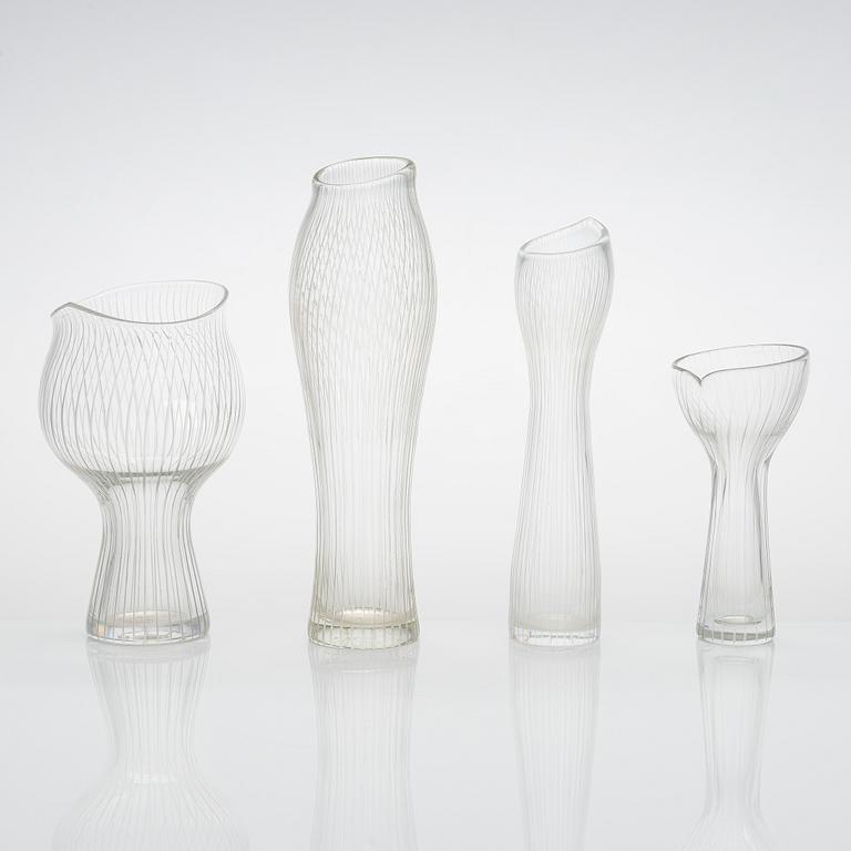 Tapio Wirkkala, four line-cut clear glass vases, signed Tapio Wirkkala Iittala.