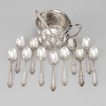 a silver cup by The Alex Clark Company, London, around 1800/1900 and 12 Swedish silver spoons from 1968. W 280 g.