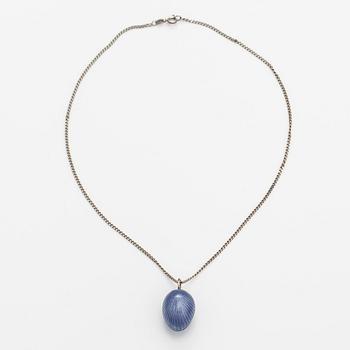 A Tillander, A silver necklace with an enameled egg.