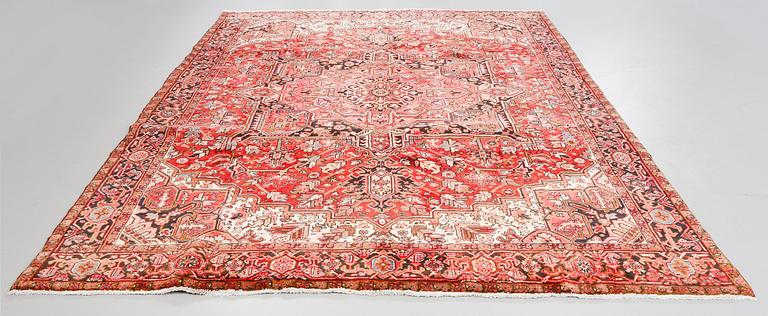 A Heriz rug, 323 x 264 cm.