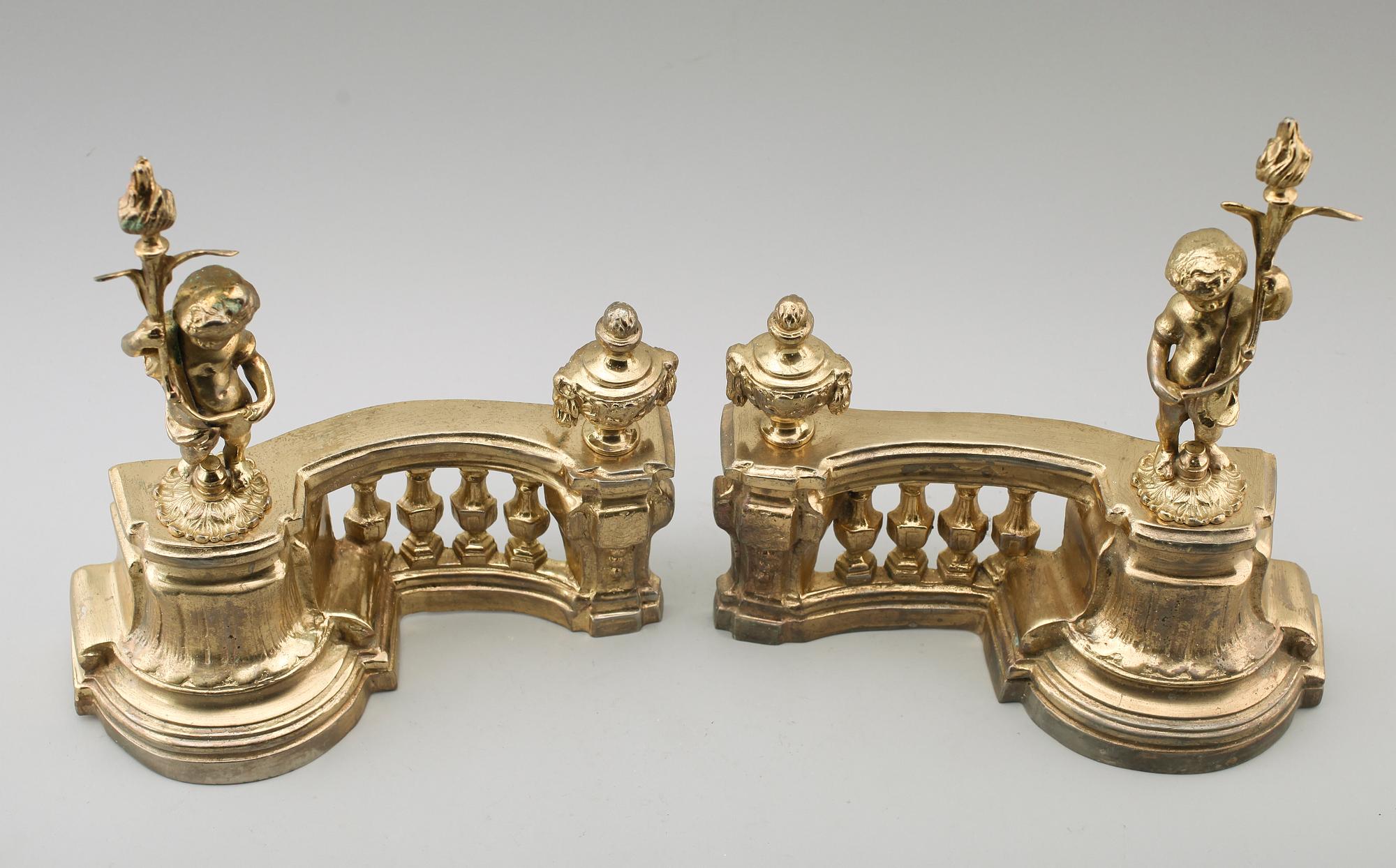 ELDHUNDAR, 1 par, förgylld metall, England, 1900-/2000-tal.