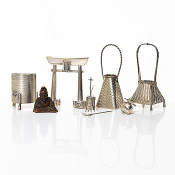 A group of 7 Japanese salts and miniatures, also a wooden netsuke, some marked sterling silver, some Meiji (1868-1912).