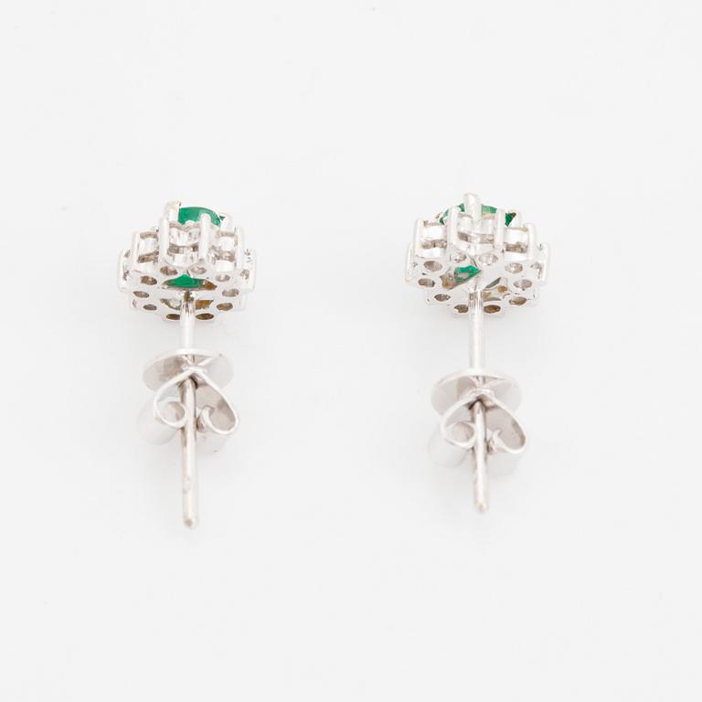 Emerald and brilliant cut diamond earrings.