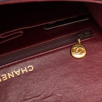 A "Double Flap bag" by Chanel.